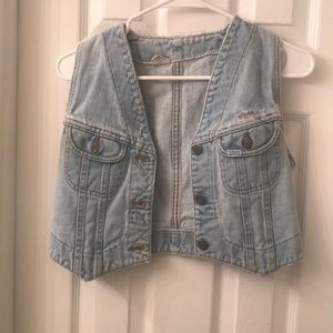 Worn blue jean vest